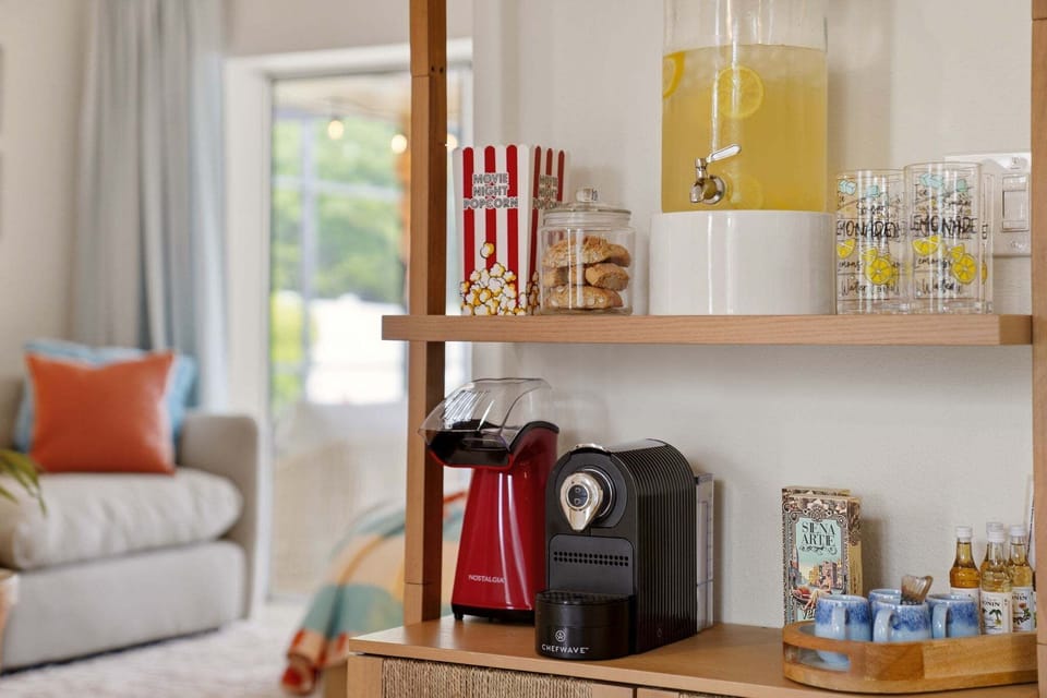 Fresh popcorn, espresso, and lemonade — all running at once if that's the vibe. The snack station means nobody has to make a grocery run for the basics.