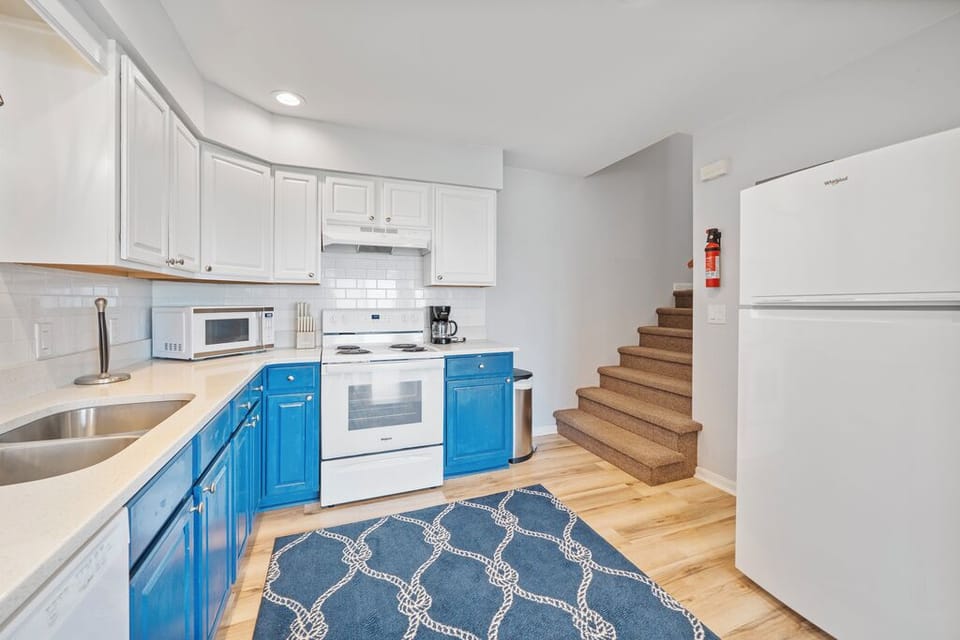 Wandering upstairs, you'll find 2 Bedrooms, a Full Bath, and the Laundry!