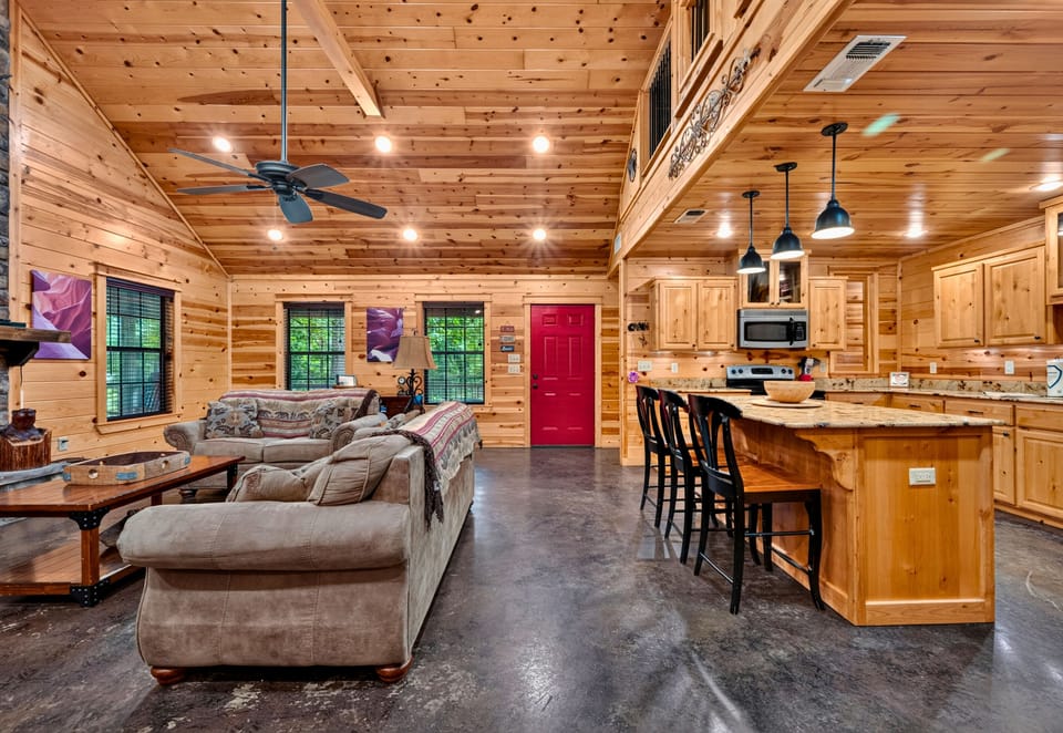 With soaring ceilings, warm wood finishes, and an open layout, the great room offers plenty of space for everyone to gather and make themselves at home.
