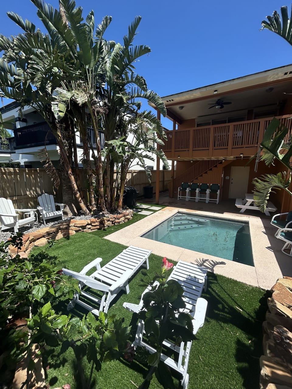 Enjoy a cool dip in the plunge pool in this relaxing backyard oasis.