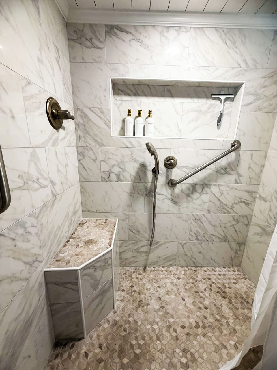 Primary Spa-style Double Head walk-in shower with marble tile