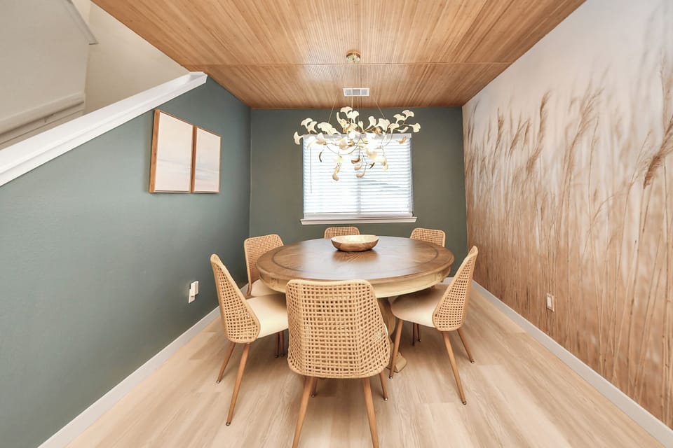 Dine in style. Gather the whole group around this beautiful round wooden dining table, thoughtfully paired with comfortable woven chairs that invite you to linger long after the meal is over. Seats up to 8.
