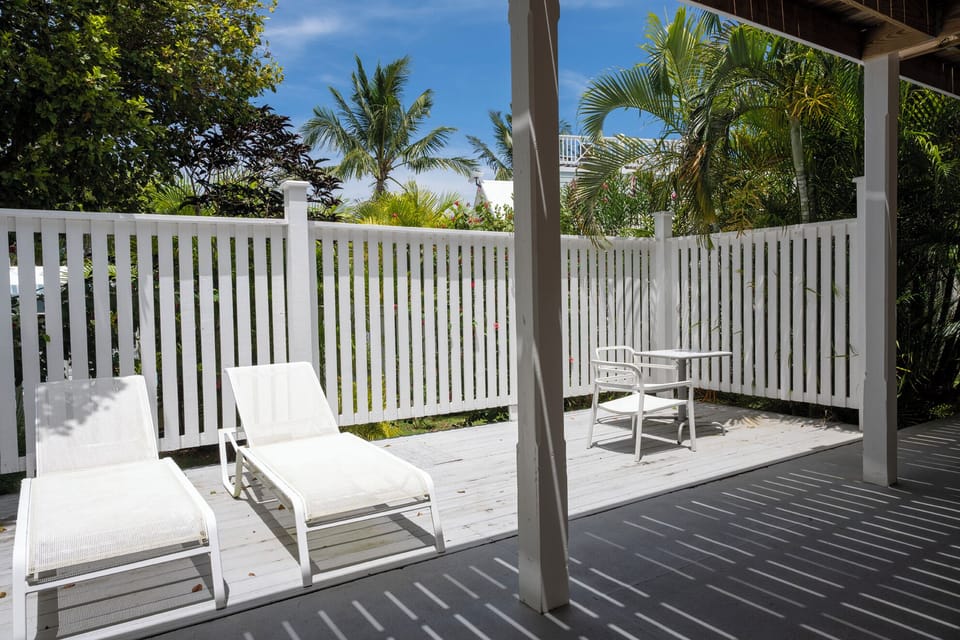 Patio with lounge chairs and table.