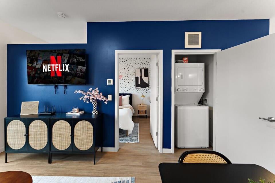 Convenient in-unit laundry area with a washer and dryer, located near the bedroom and main living space.