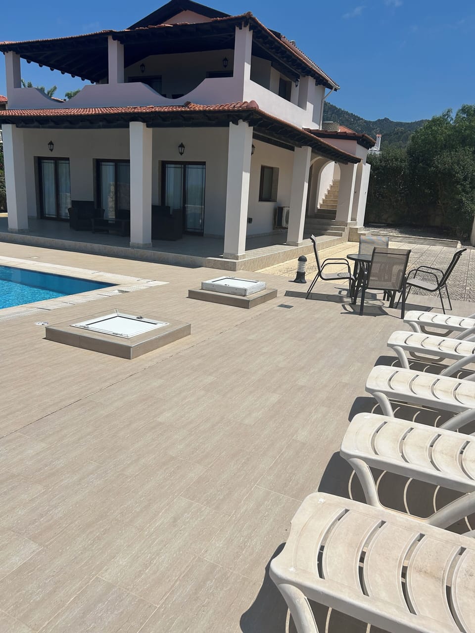 Pool deck and outside villa 