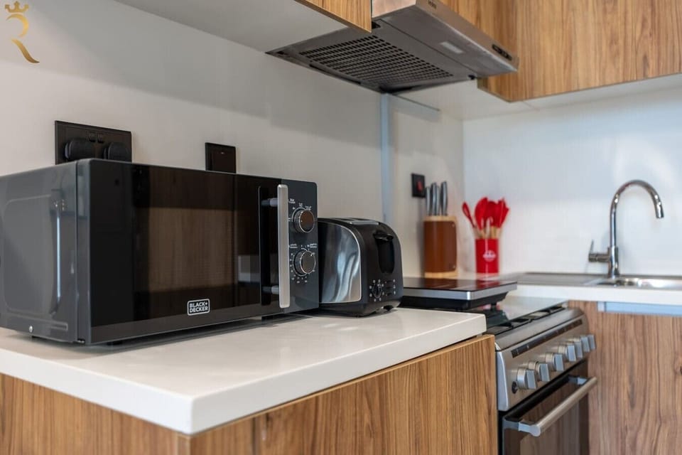 Fully equipped with modern appliances and cookware for easy meal prep.