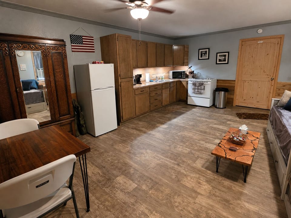 Spacious area for sleeping, cooking, eating, and watching TV.