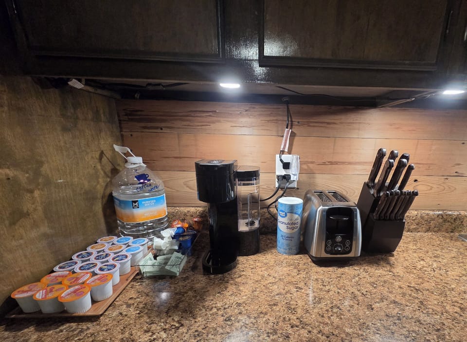 Complete coffee bar, drip coffeemaker & coffee available in upper cabinets.