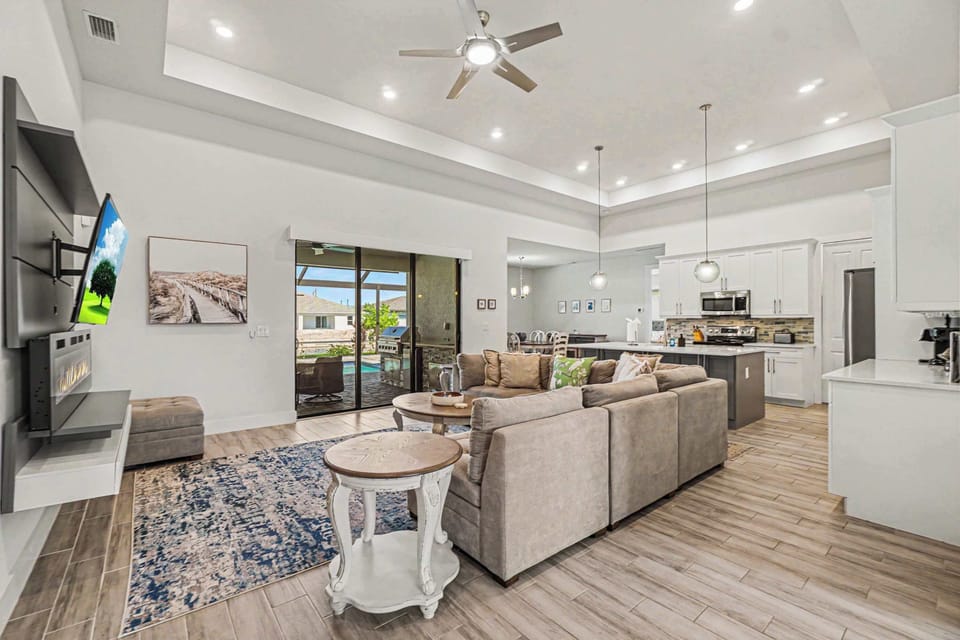Living room has pool and canal view
