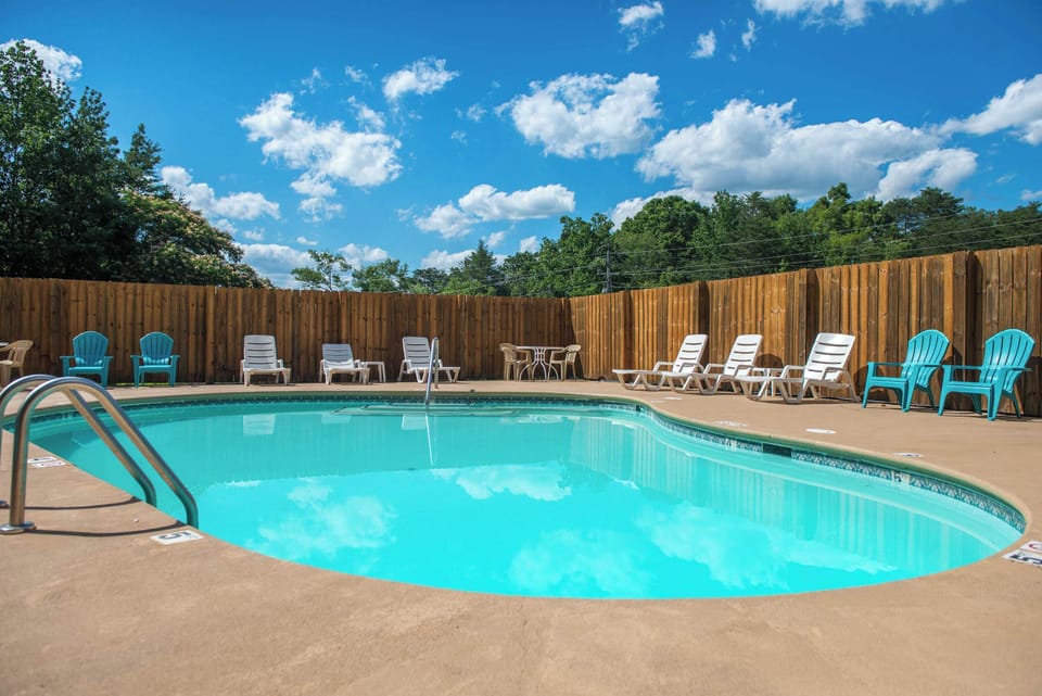 Dive into relaxation at this sparkling pool surrounded by vibrant seating!