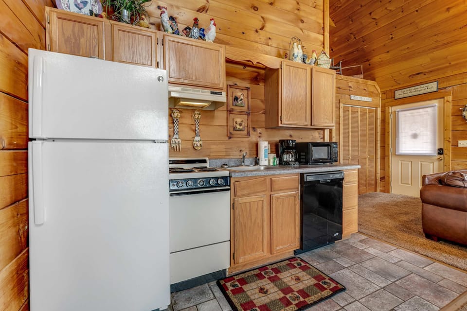 Kitchen, whip up your favorite meals in this charming, fully-equipped kitchen with rustic decor!