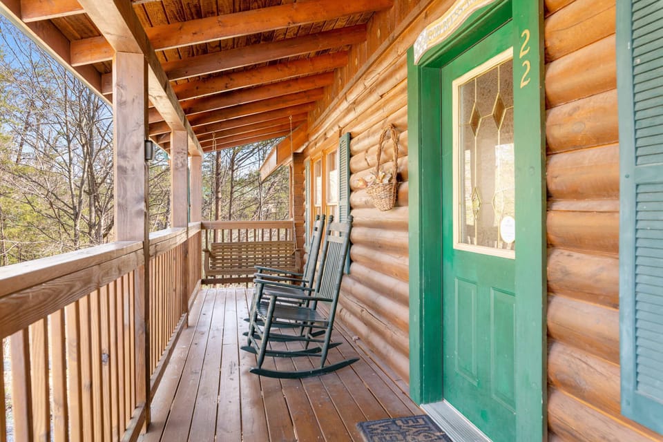 Porch Paradise, relax in rocking chairs with scenic views in this charming wooden retreat!