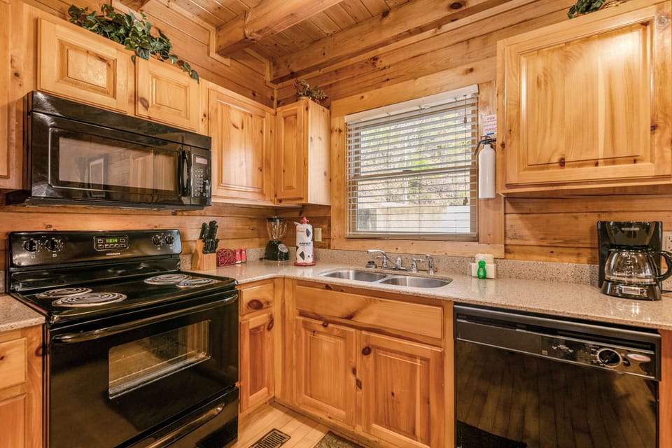 Kitchen Delight, gather in this rustic kitchen with modern appliances and charming wood accents!