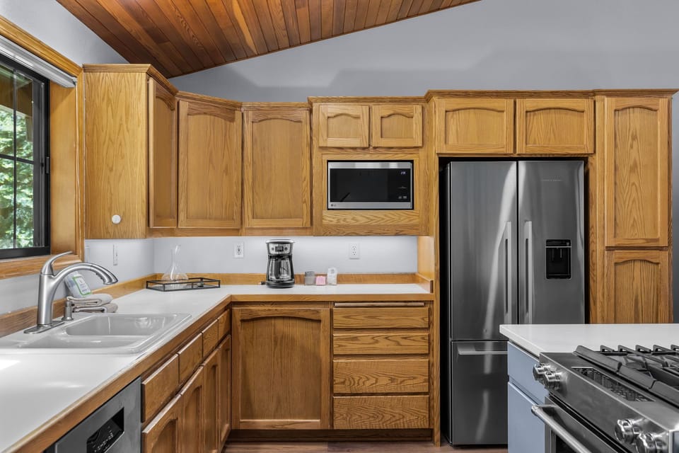 The bright, fully-equipped kitchen features modern appliances and ample counter space, perfect for preparing your favorite meals during your stay.