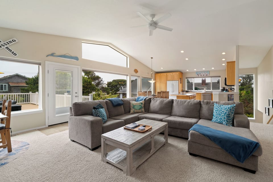 Sink into the oversized sectional and unwind in this sun-filled space, where coastal breezes and ocean-inspired accents invite pure relaxation after your beach adventures.