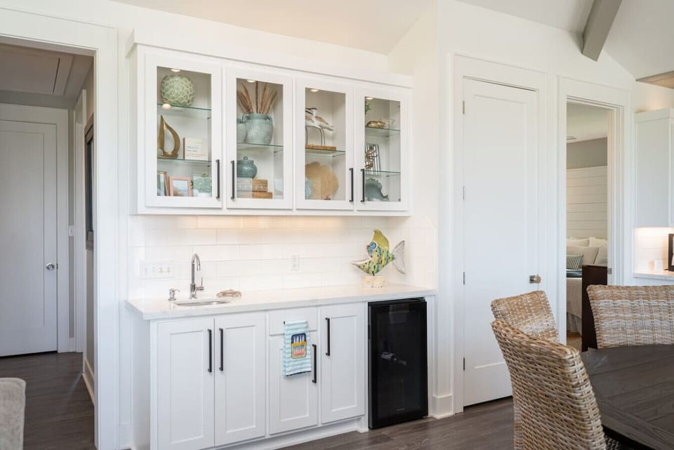 Bar area with sink and wine refrigerator