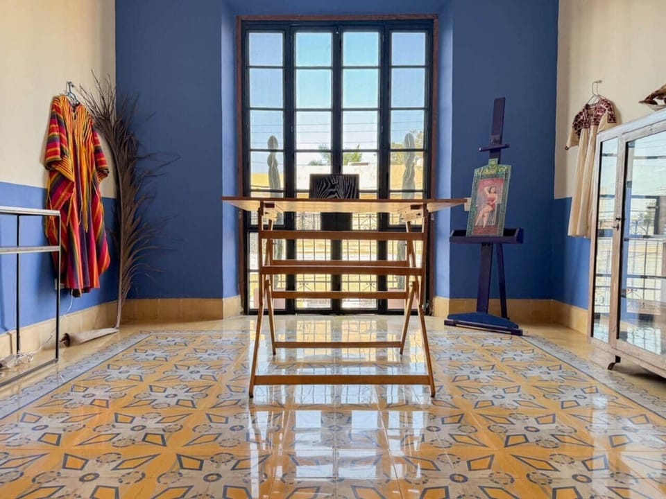 A large, sunny room that can be used as an office, art studio, or yoga studio.