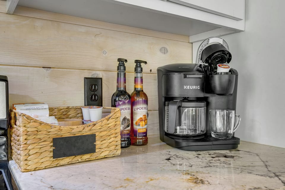 Guest-ready coffee bar with Keurig, syrups, and all the essentials