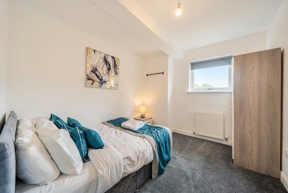 Tranquil bedroom with artful touches and ample wardrobe space