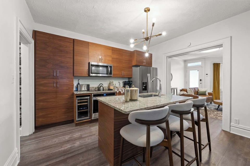 Warm wood kitchen w/ island seating for quick breakfasts or chatting while cooking.