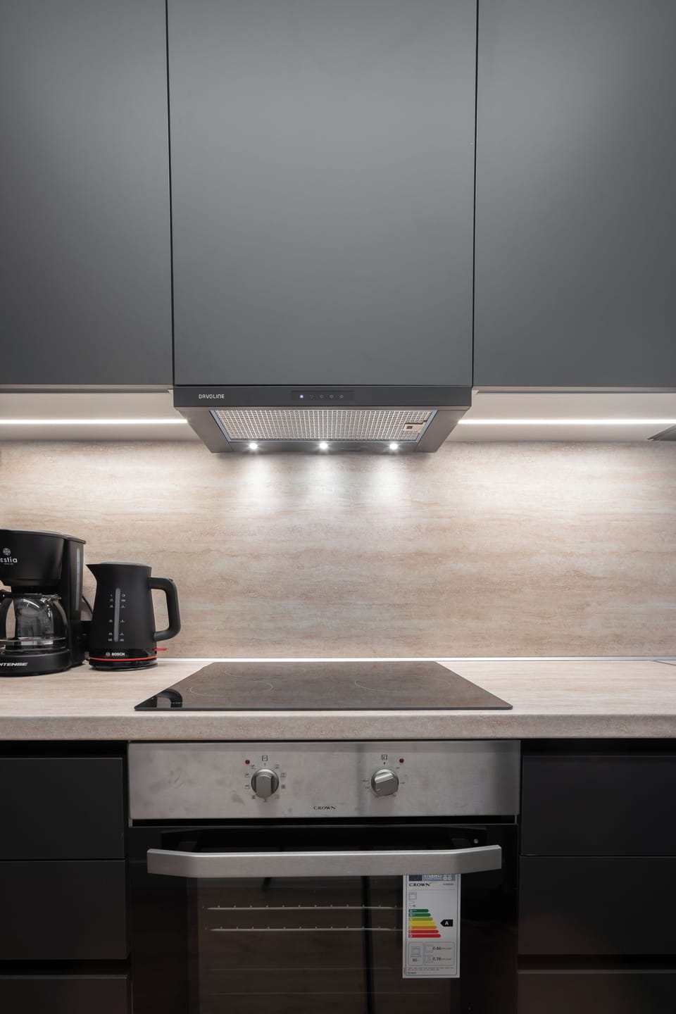 Modern kitchen with sleek Davoline extractor fan and ambient lighting.