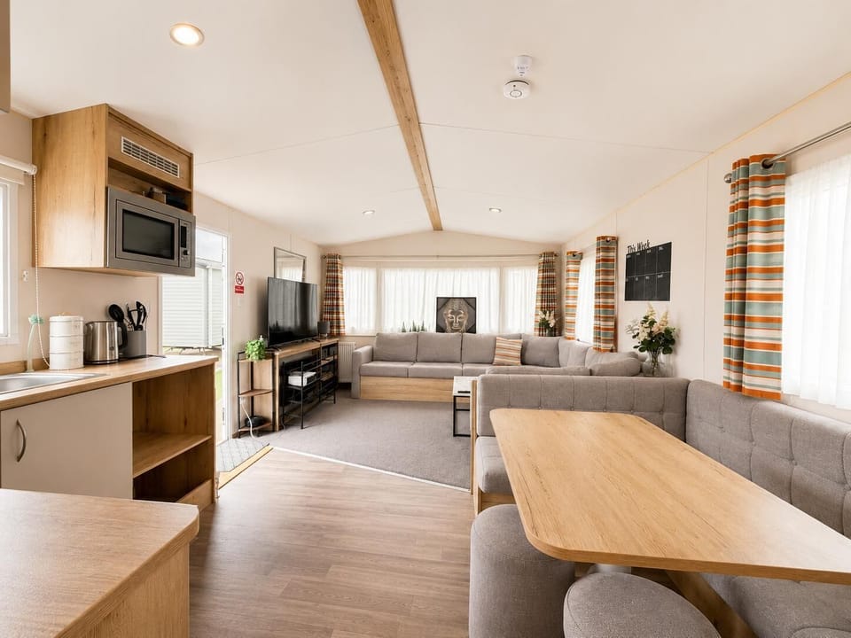 The living room is designed for relaxation, making it ideal for family holidays or couple getaways.
