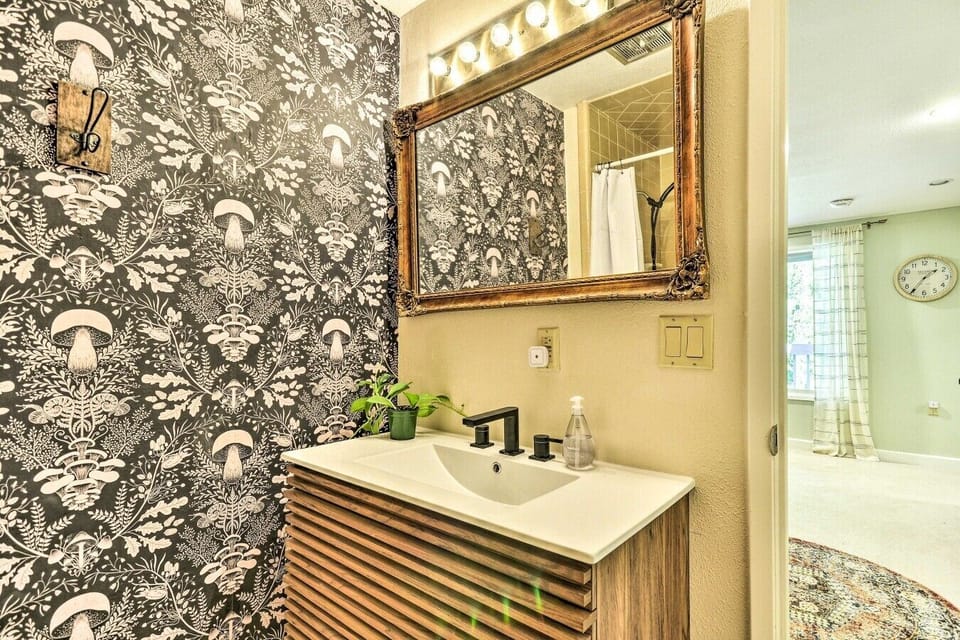 Bathroom | Mushroom Wallpaper Accent Wall | Gold Mirror & Modern Vanity