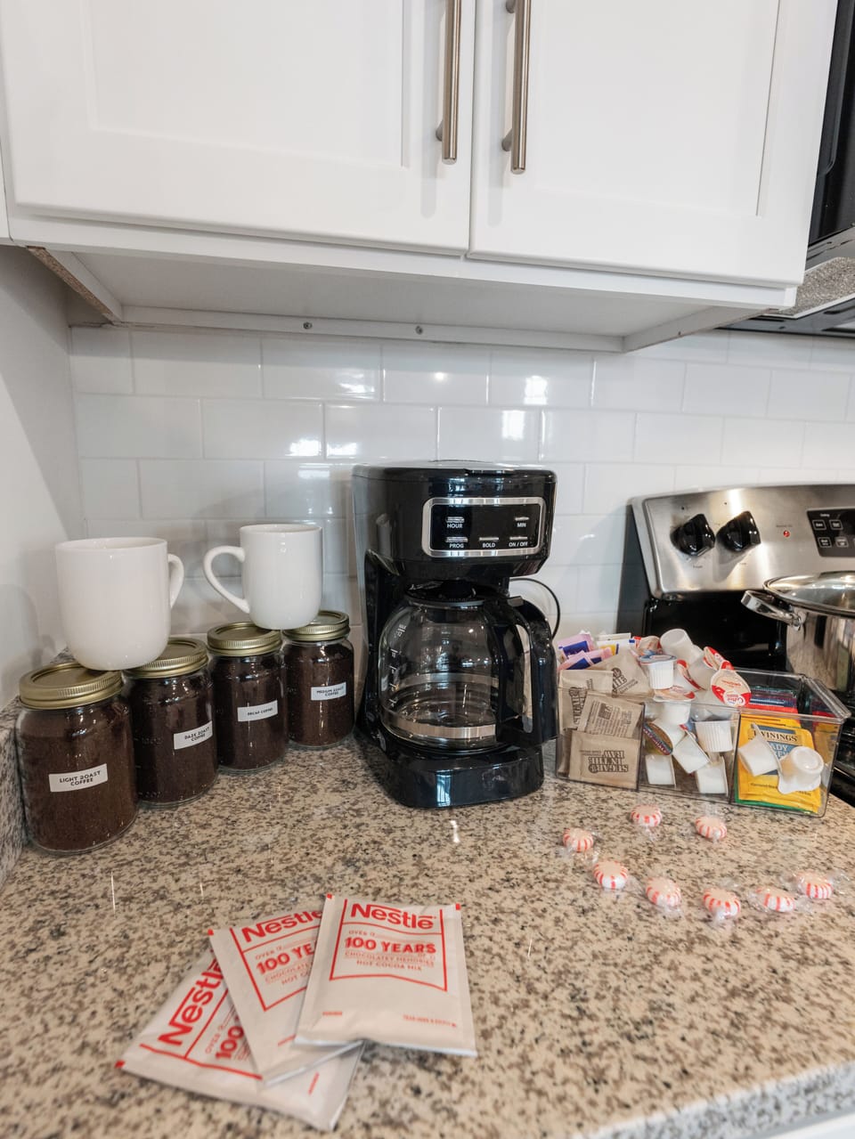 Modern kitchen with delicious complementary coffee area with bonus treats!