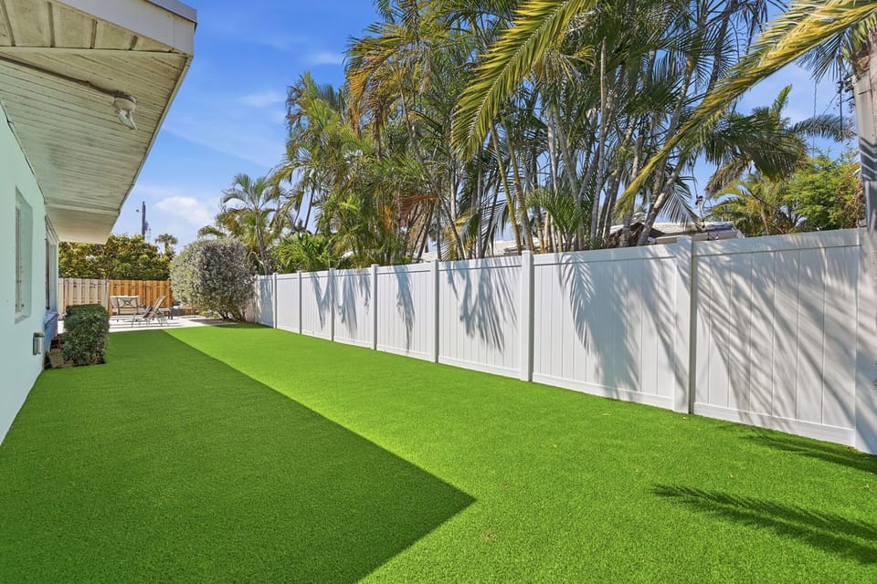 Fully Fenced in backyard with pet friendly artificial grass