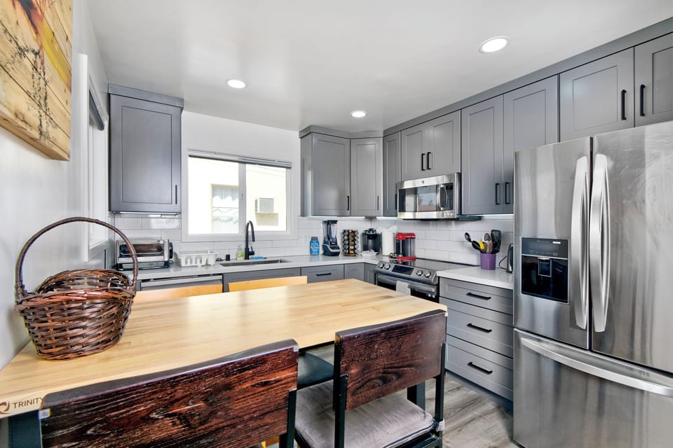 Unit A fully equipped kitchen with island and full-size appliances