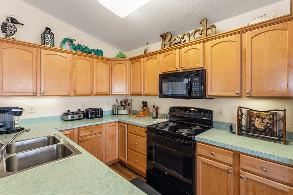 Prepare everything from quick breakfasts to family feasts in the fully equipped kitchen designed for easy vacation living.