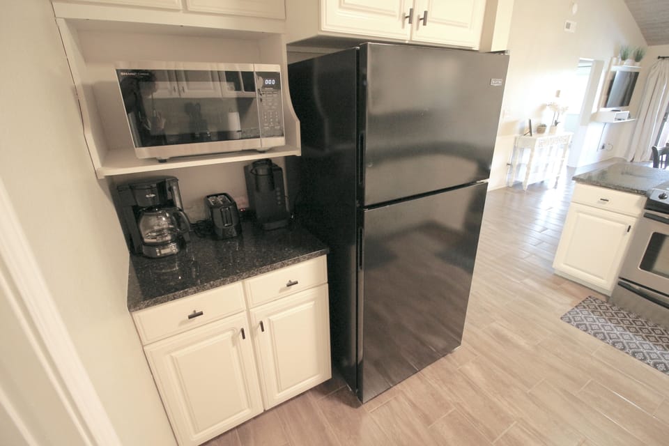 Bright kitchen with full-size appliances and a convenient coffee station