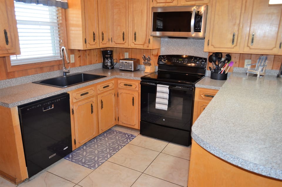 Coffee maker, toaster, dishes, & cookware provided.