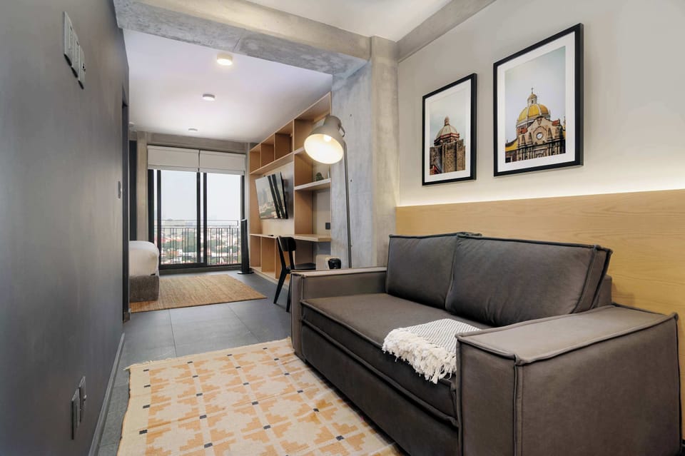 Comfortable sofa provides extra sleeping space while keeping the living area cozy and inviting.