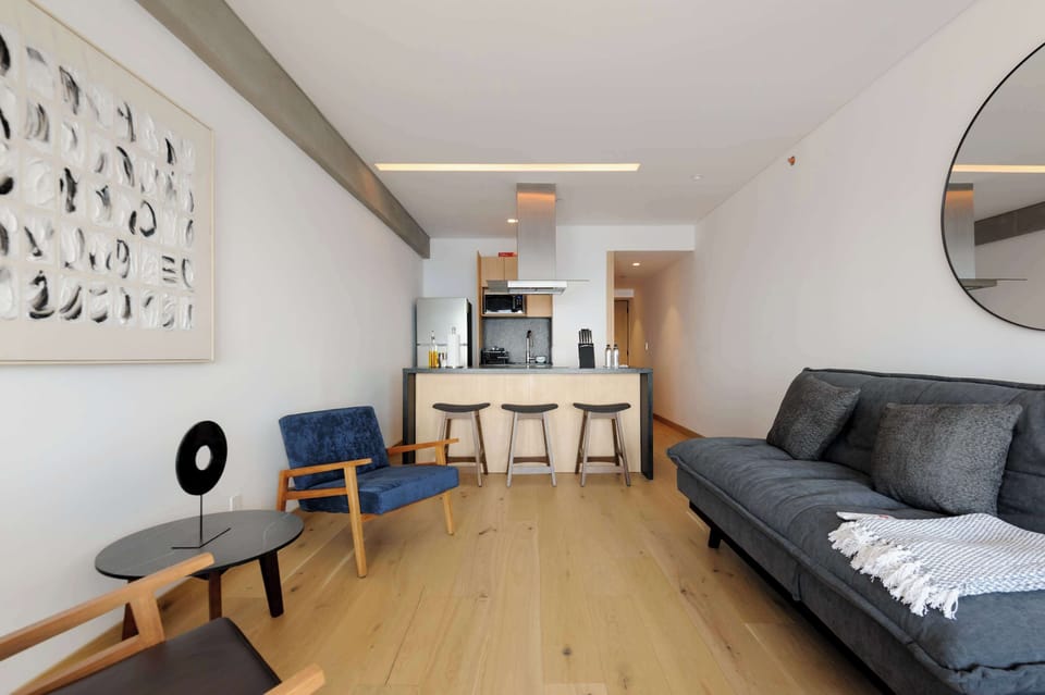 Open-concept social area featuring a dining space, living room, and thoughtfully designed interiors.