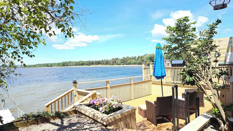 Lowest balcony with patio furniture and access to lake