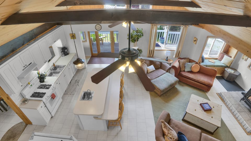 A bird's-eye view of the cozy living room from this inviting loft.