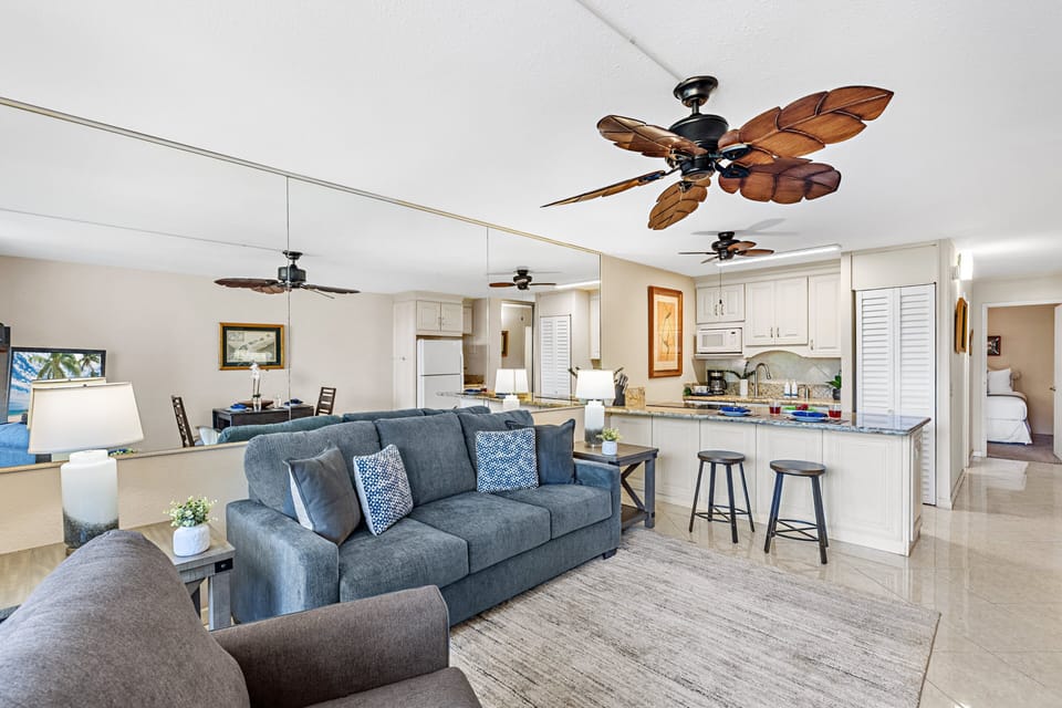 Open-concept living space with comfortable seating and island-style décor