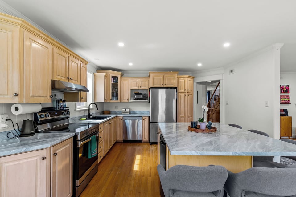Modern kitchen with generous counter space and everything needed for home-cooked meals