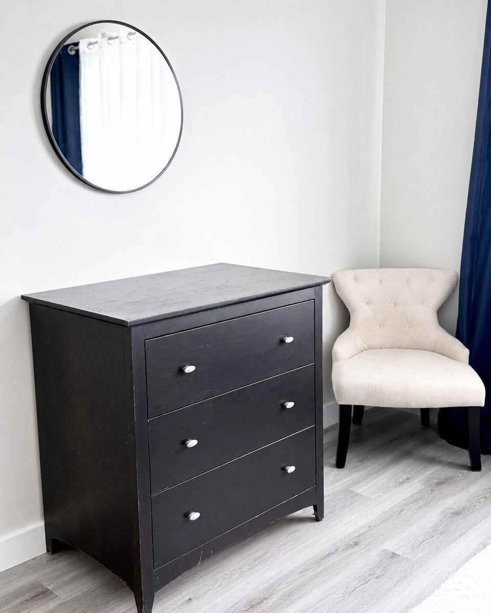 Convenient dresser and cozy accent chair provide both comfort and functionality.