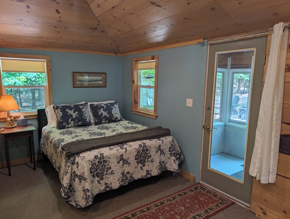 LIVING ROOM: The comfy, cozy queen bed adjoined to the living room