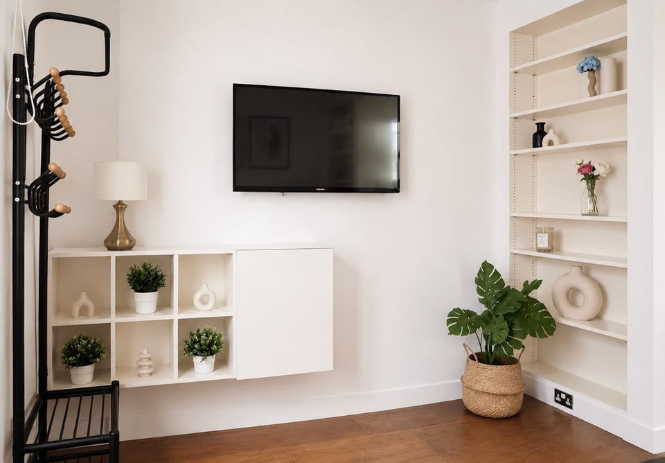 There is a flat screen TV with local channels and free Wi-FI