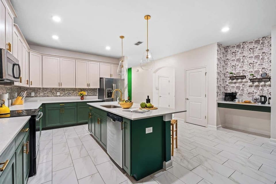✨ A Kitchen That Inspires! The perfect blend of sophistication and charm—emerald green cabinets, gold accents, and a coffee nook that’s a caffeine lover’s dream! ☕ Who else loves this elegant yet cozy space? #ModernKitchen #LuxuryLiving