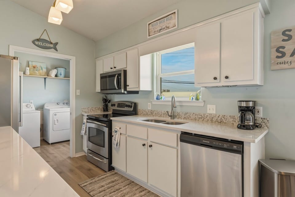 Your bright, fully-equipped kitchen makes meal prep easy with stainless steel appliances, plenty of counter space, and a beautiful view through the window to inspire your cooking.