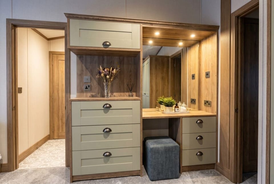 Handy dressing area with mirrored vanity and ample storage.