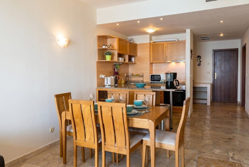 Open-plan dining and kitchen make easy family living just steps from the door.