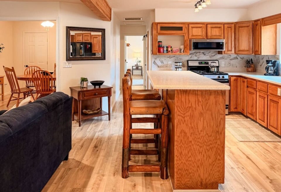 Open-concept kitchen with bar seating keeps everyone connected while cooking, dining, and relaxing together