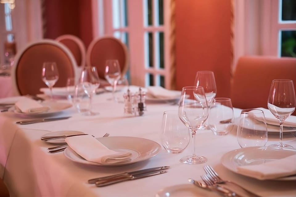 Indulge in elegant dining with beautifully set tables and ambiance.