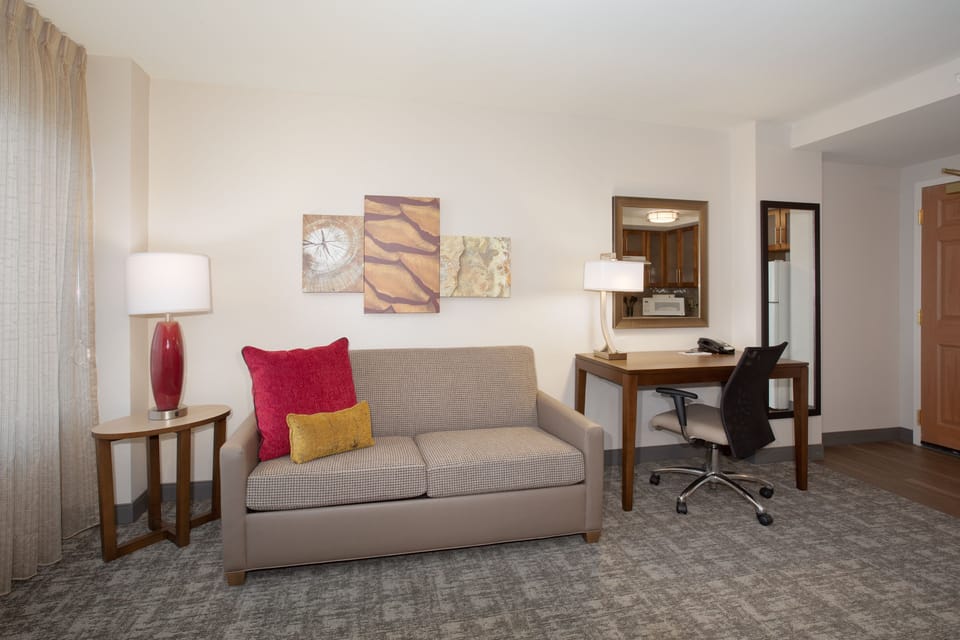 Inviting living area with a chic sofa and decorative elements.