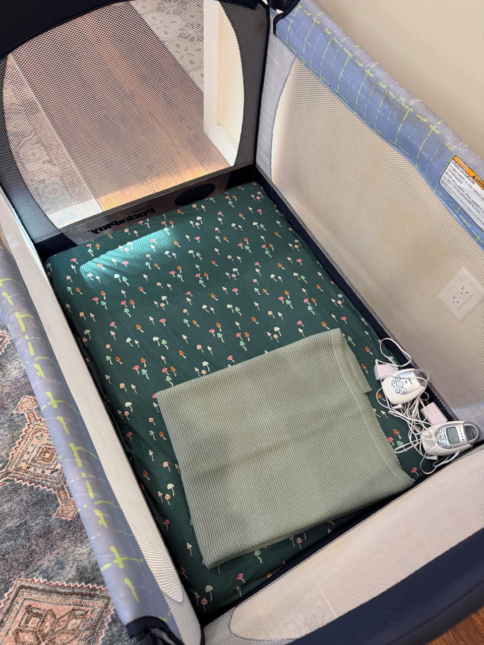 Pack n Play with audio monitor is located in the primary walk in closet 